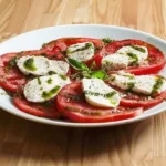 Ensalada de tomate y mozzarella con pesto