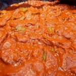 Tortitas de Camarón con Nopales en Salsa Roja